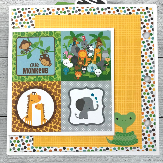 Zoo or Jungle themed scrapbook album page with lots of cute animals, prints, & palm trees