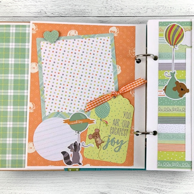 Baby Boy Scrapbook Album Page with a cute raccoon, mouse, bear, balloons, and a tag with ribbon