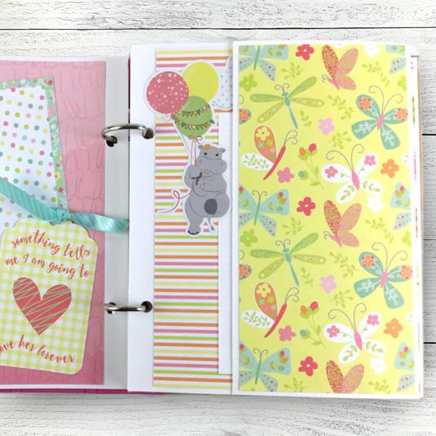 Baby Girl Scrapbook Album Page with pretty butterflies, flowers, and a cute hippo with balloons