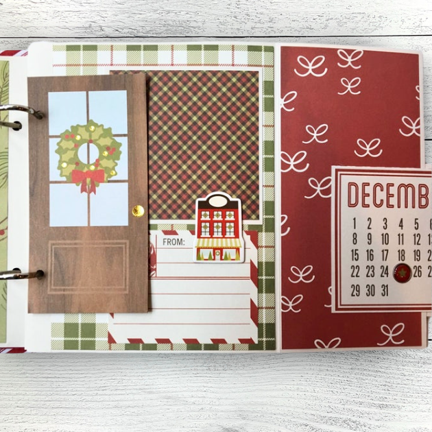 Magic of Christmas Scrapbook Album Page with a wooden door, a wreath, a December calendar, and a lined journaling card
