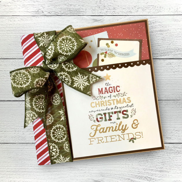 Magic of Christmas Scrapbook Mini Album with a scalloped trim, cards, candy cane stripes, holly leaves and berries, and a a big green bow 