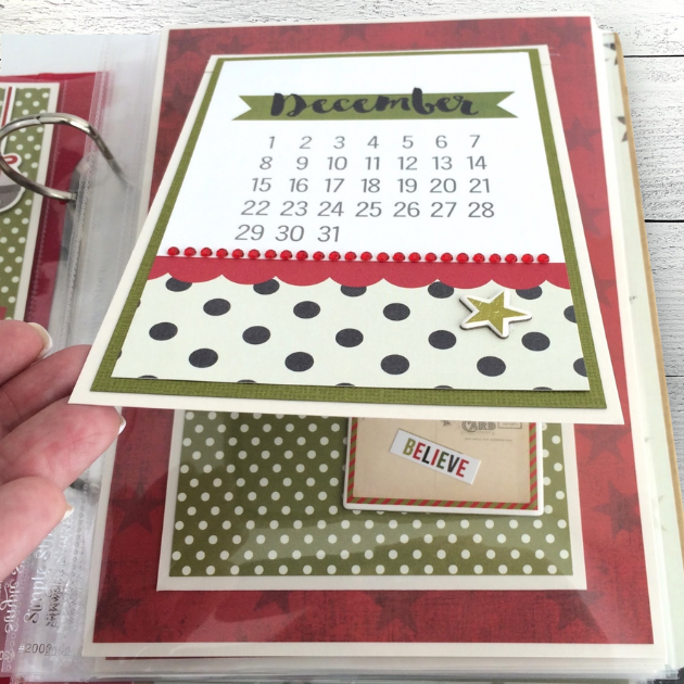 Dec. 25th Christmas Scrapbook Album Page with a folding card, polka dots, a December calendar, and red jewels