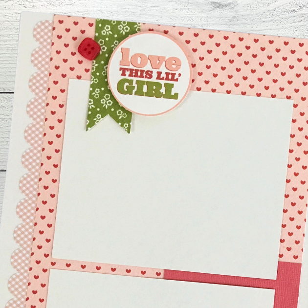 12x12 It's A Girl Baby Scrapbook Page Layout with hearts, flowers, a scalloped border sticker, and a cute red button