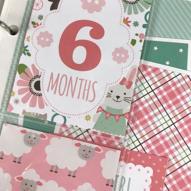 Sweet Baby Girl Scrapbook Album Page with a 6 month card, flowers, sheep, and a gorgeous pink plaid