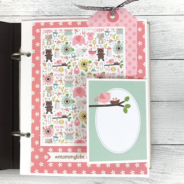 Sweet Baby Girl Scrapbook Album Page with lots of cute animals, flowers, a polka dot tag, ribbon, and a folding card 