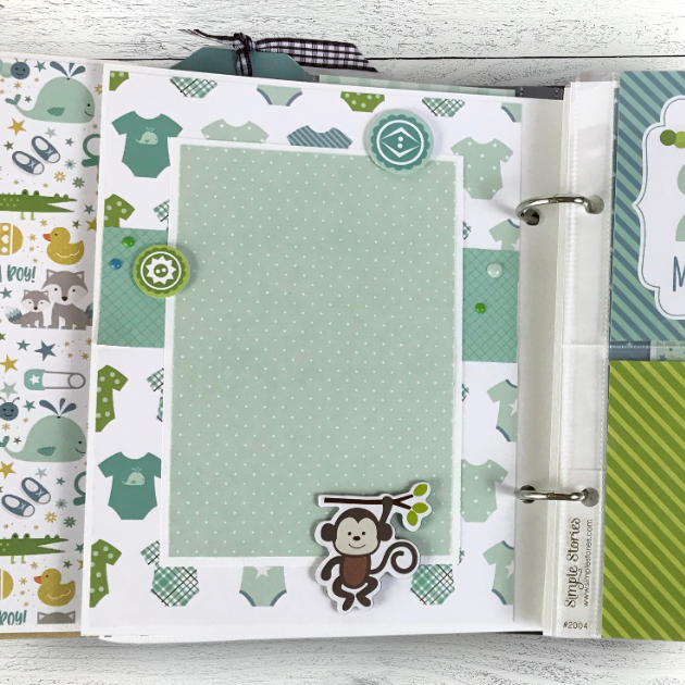 Sweet Baby Boy Scrapbook Page with little clothes and a cute monkey hanging from a branch 