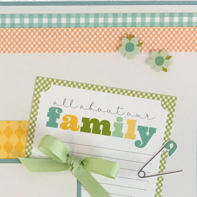 12x12 It's A Boy Baby Scrapbook Page Layout with a journaling card with a safety pin, diamond shapes, a green bow, and a gingham paper