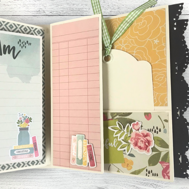 I AM Scrapbook Mini Album page with flowers, books, a pocket, a tag with ribbon, and a scalloped lace trim