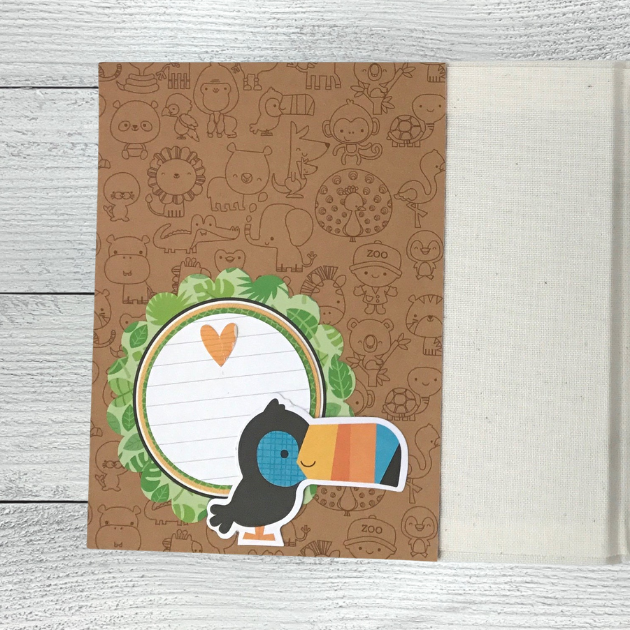 A Day at the Zoo Scrapbook Album page with a toucan bird and a journaling spot