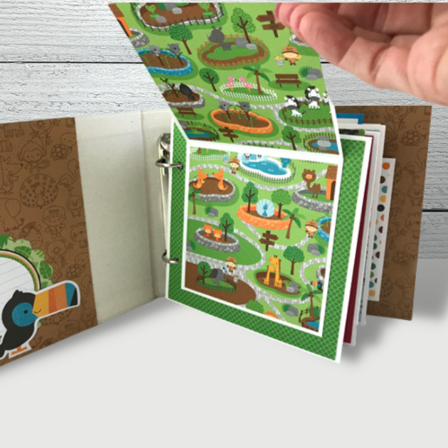 A Day at the Zoo Scrapbook Album folding page with lots of bright colors and cute animals