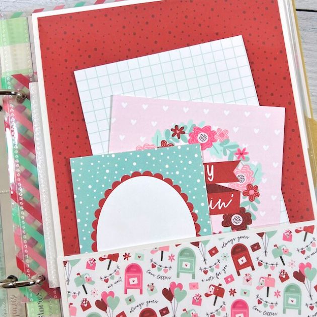 Love is All You Need Scrapbook Album Page with mailboxes, hearts, balloons, flowers, a pocket and journaling cards