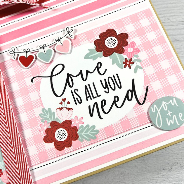 Love is All You Need Scrapbook Album with hearts, flowers, and a pretty red bow
