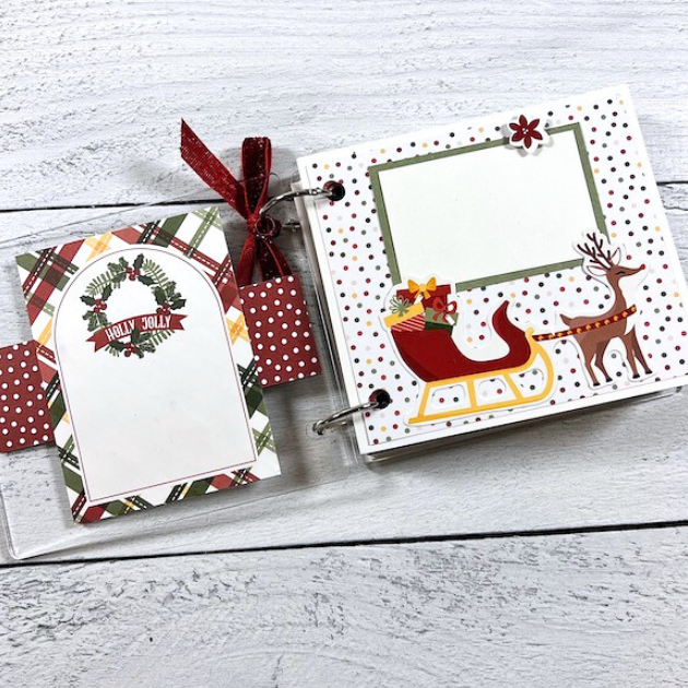 White Christmas Scrapbook Album Pages with a reindeer, sleigh, presents, a wreath, and colorful polka dots
