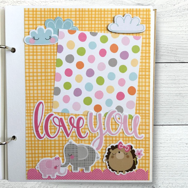 Baby Girl scrapbook album with elephants, a hedgehog, clouds, and polka dots