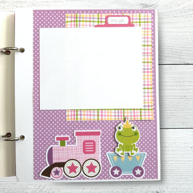 Baby Girl scrapbook album with a train, a frog with a crown, and polka dots