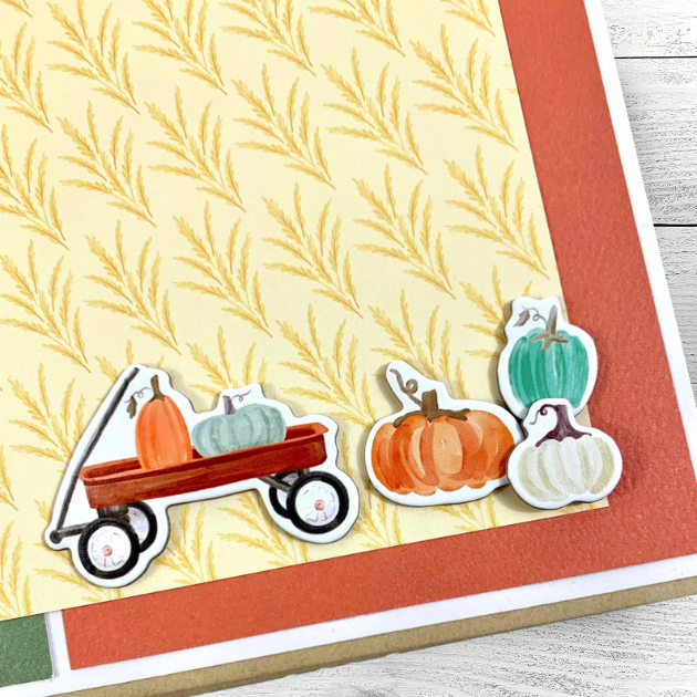 Hello Fall Scrapbook Mini Album page with colorful pumpkins, a red wagon, and wheat 