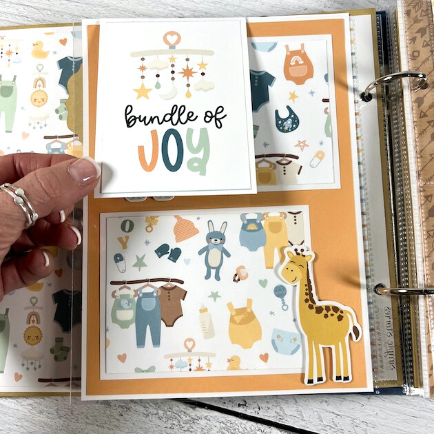 Twinkle Twinkle Baby Scrapbook Album Page with a flippie, toys, baby clothes, and a cute giraffe 