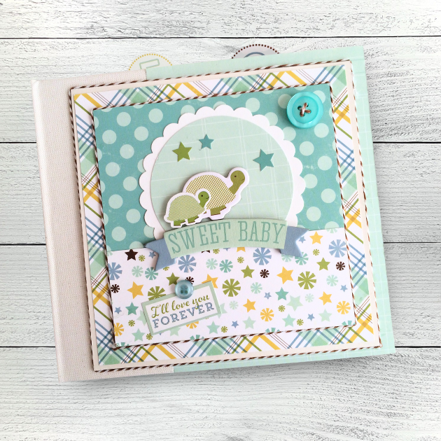 Sweet Baby Boy Scrapbook Mini Album with a scalloped circle, cute turtles, polka dots, stars, and an aqua blue buttons