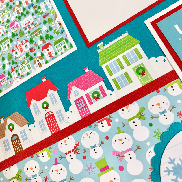 12x12 Christmas Town Scrapbook Layout with lots of cute snowmen and houses with wreaths