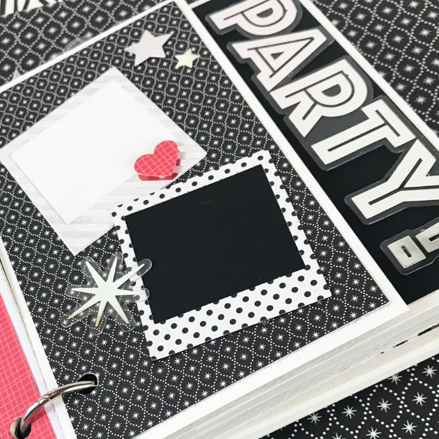 Happy New Year Scrapbook Album Page with a black and white design, stars, frames, & an acetate party die cut