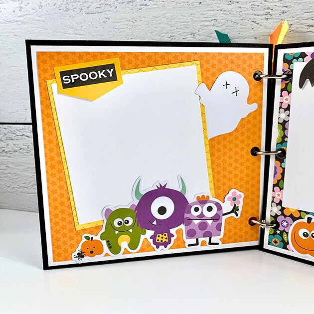 My Favorite Monsters Halloween Scrapbook Album Page with stars, silly monsters, a flying ghost, and a photo mat