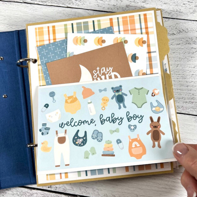 Twinkle Twinkle Baby BOY Scrapbook Album Page with a pocket and journaling cards, a folding card, baby clothes, and toys