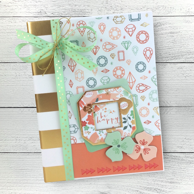 Be Happy Scrapbook Mini Album with jewels, flowers, a ribbon, and metallic gold stripes