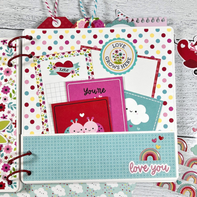 Valentine's Day Lots of Love scrapbook album page with polka dots, a pocket, and cute journaling cards