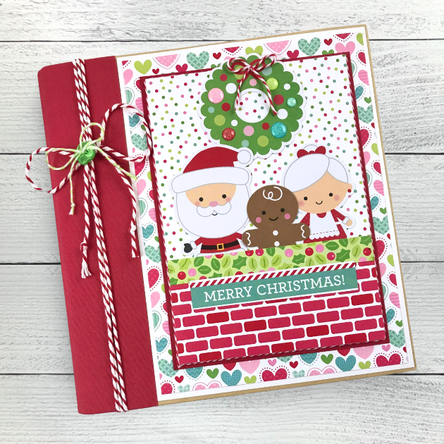 Christmas Scrapbook Album with Mr. & Mrs. Santa Claus, a wreath and a gingerbread 