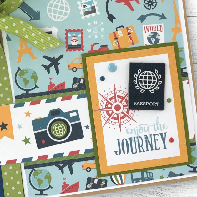 Enjoy The Journey Travel Scrapbook Mini Album with a passport, globes, airplanes, cameras, cars, ships, and luggage