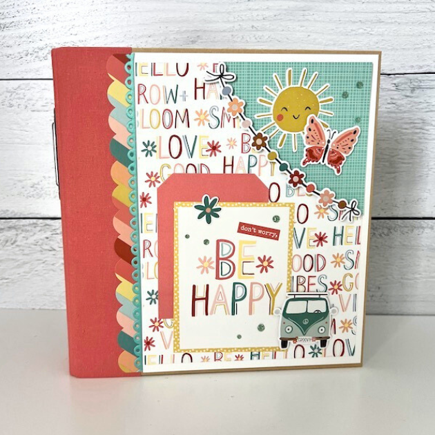 Be Happy Scrapbook Album with butterflies, rainbows, flowers, and a sunshine