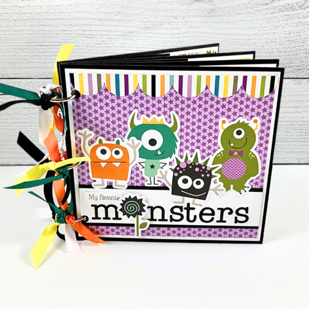 My Favorite Monsters Halloween Scrapbook Mini Album with stars, silly monsters, stripes, a scalloped border, and colorful ribbons