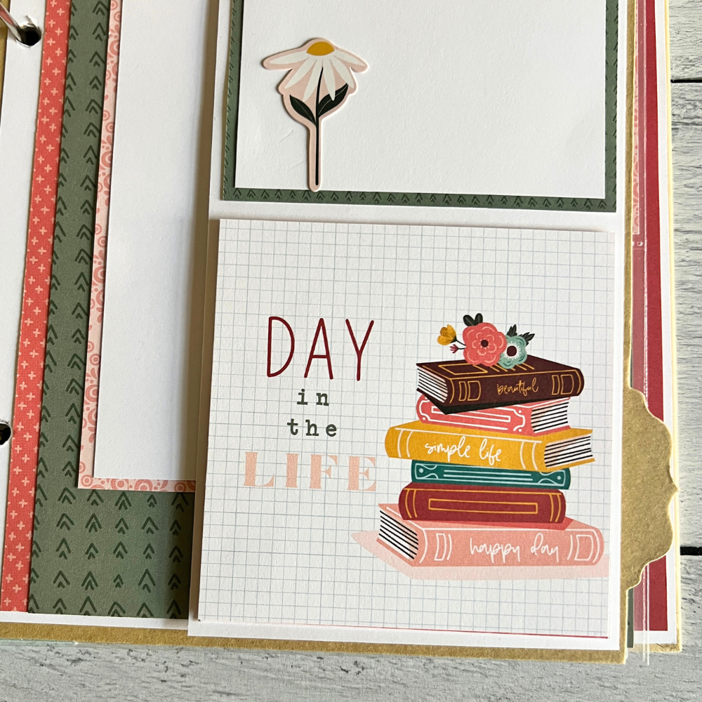 A Year in Review Scrapbook Album Page with daisy flowers and books