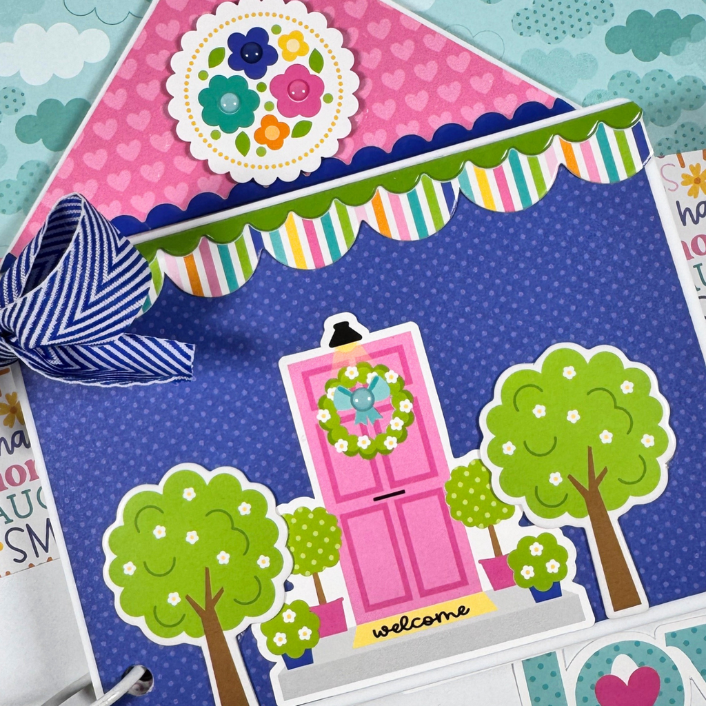 House Shaped Family Scrapbook Mini Album with a pink door, flowers, hearts, a bow, and cute trees
