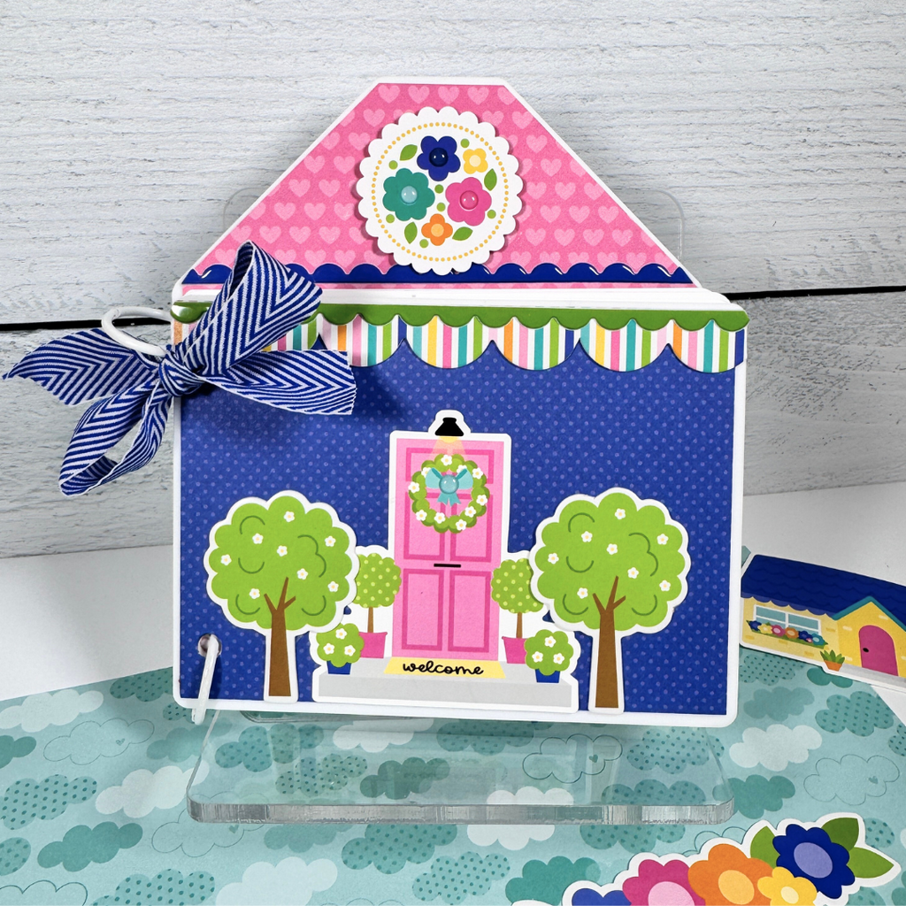 House Shaped Family Scrapbook Album displayed on a clear acrylic stand