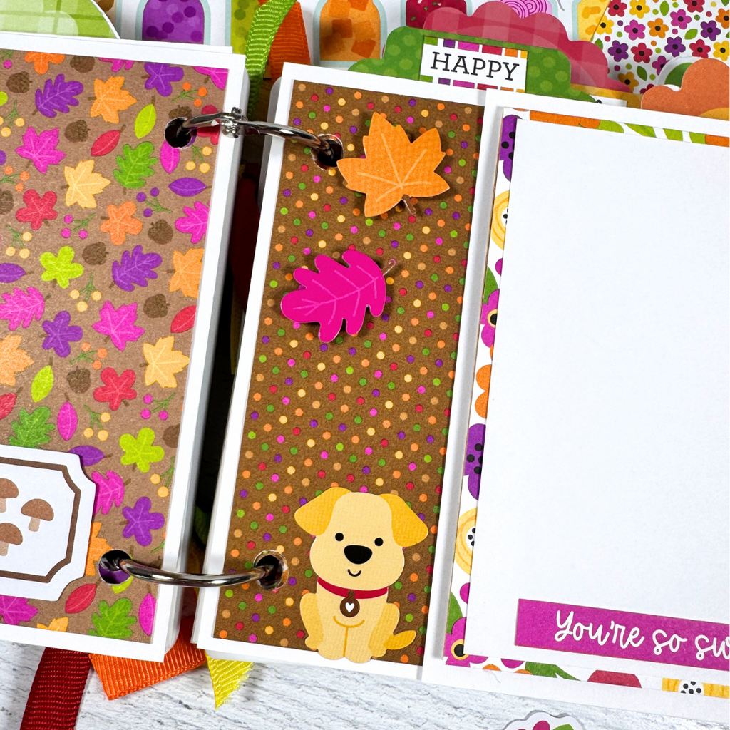 Our Family Memories Fall Scrapbook Album Page with colorful fall leaves, a cute dog, and a folding element