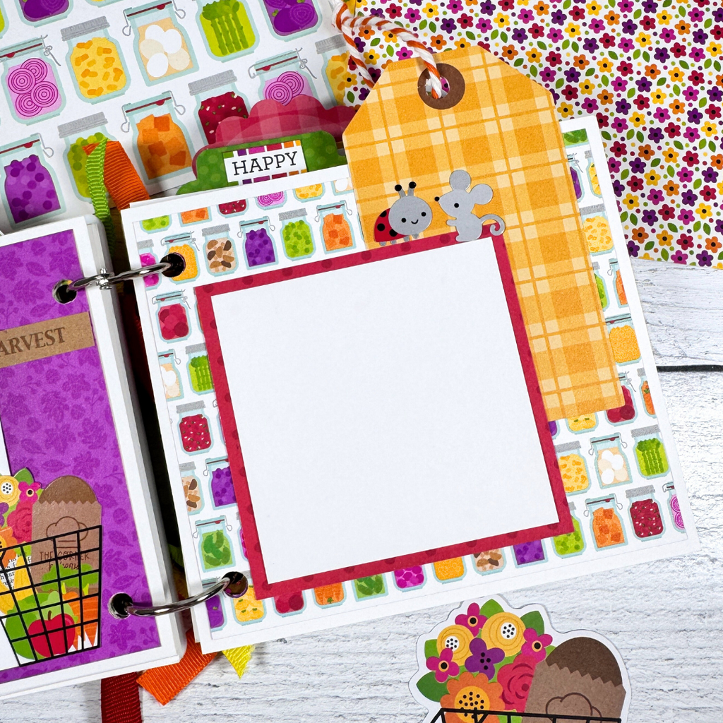 Our Family Memories Fall Scrapbook Album Page with a ladybug, a mouse, a plaid tag, twine, and canned jars