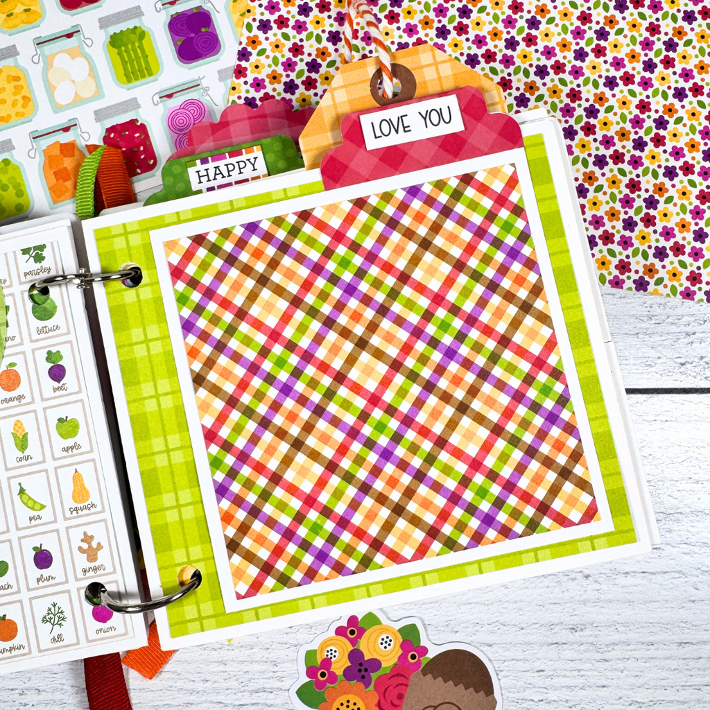 Our Family Memories Fall Scrapbook Album Page with a colorful plaid paper, a photo mat, and a tab