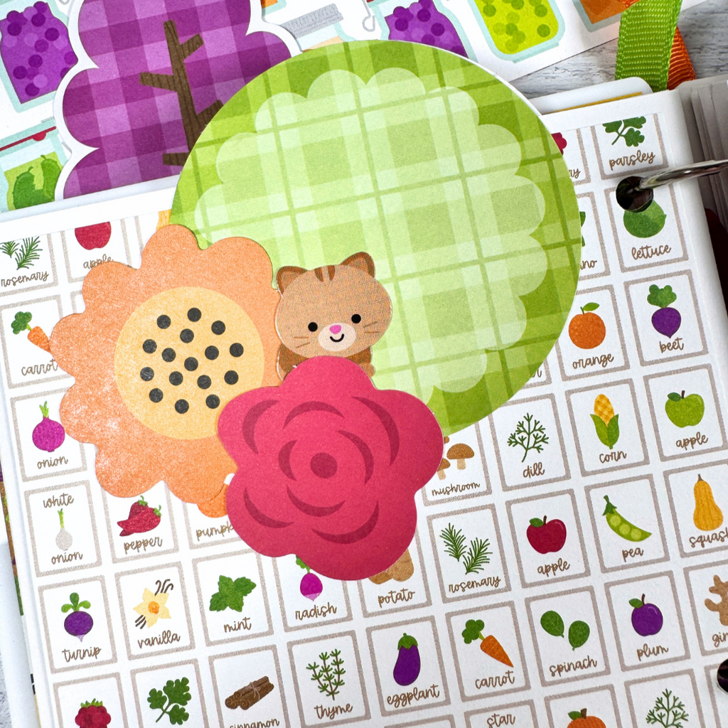 Our Family Memories Fall Scrapbook Album Page with flower die cuts, a cute little cat, and vegetables