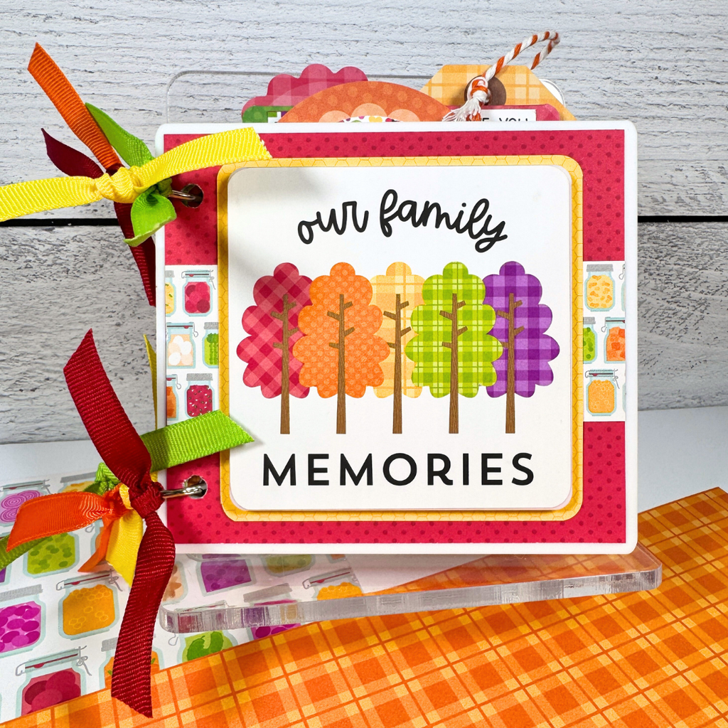 Our Family Memories Fall Scrapbook Album with colorful trees, polka dots, and cute canned jars