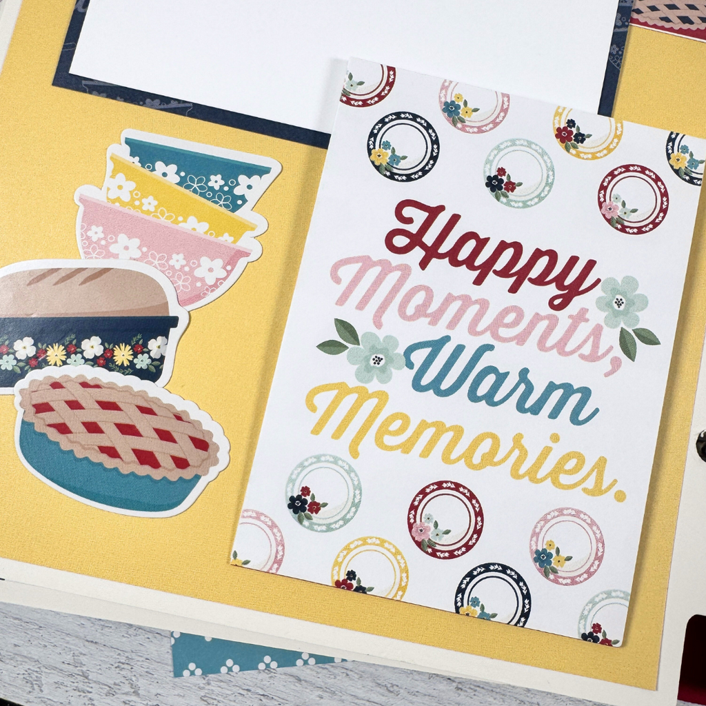 Recipe Scrapbook Album Page with mixing bowls, a pie, bread, dishes, flowers, and a photo mat