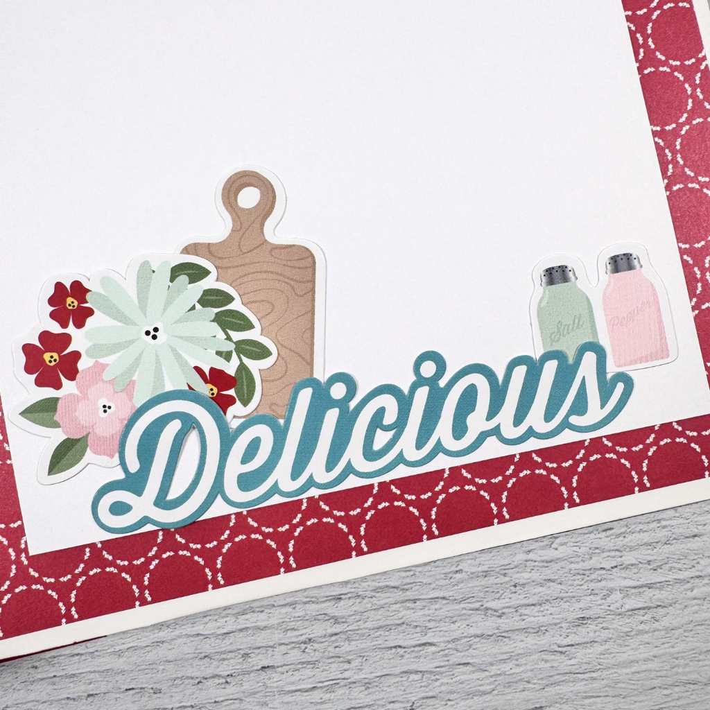 Recipe Scrapbook Album Page with a cutting board, salt and pepper shakers,  flowers, and a photo mat