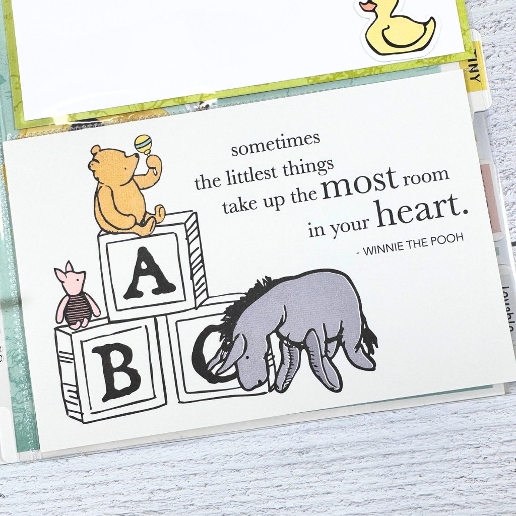 Winnie the Pooh Baby Scrapbook Album Page with Pooh Bear, Piglet, baby blocks, and a folding card