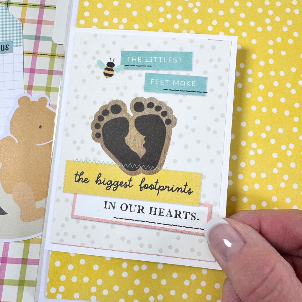 Winnie the Pooh Baby Scrapbook Album Page with a cute folding card, footprints, and polka dots