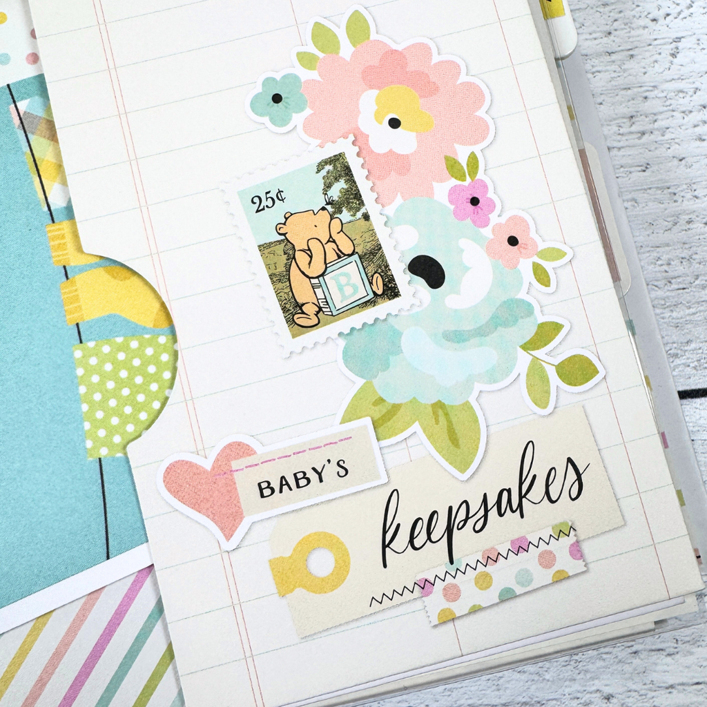 Winnie the Pooh Baby Scrapbook Album Pocket Page with a cute stamp, flowers, and journaling cards