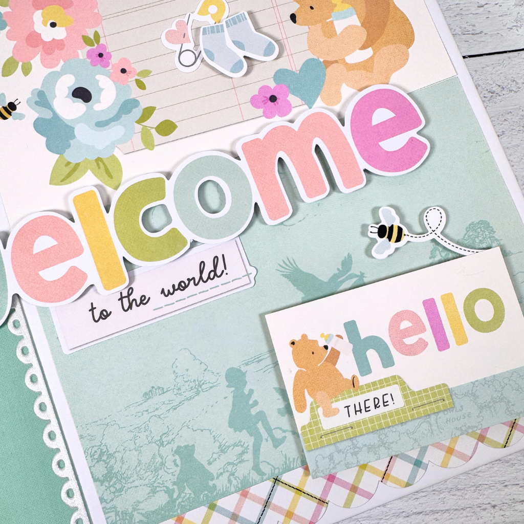 Winnie the Pooh Baby Scrapbook Album with bees, baby items, flowers, and soft colors