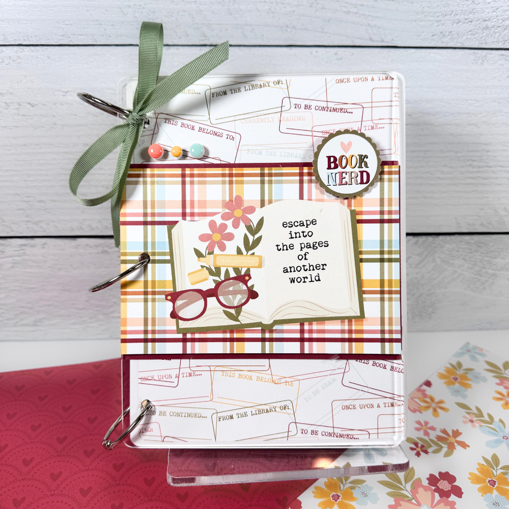 Escape Into The Pages Book Reading Journal Scrapbook Album with flowers, books, and typewriters