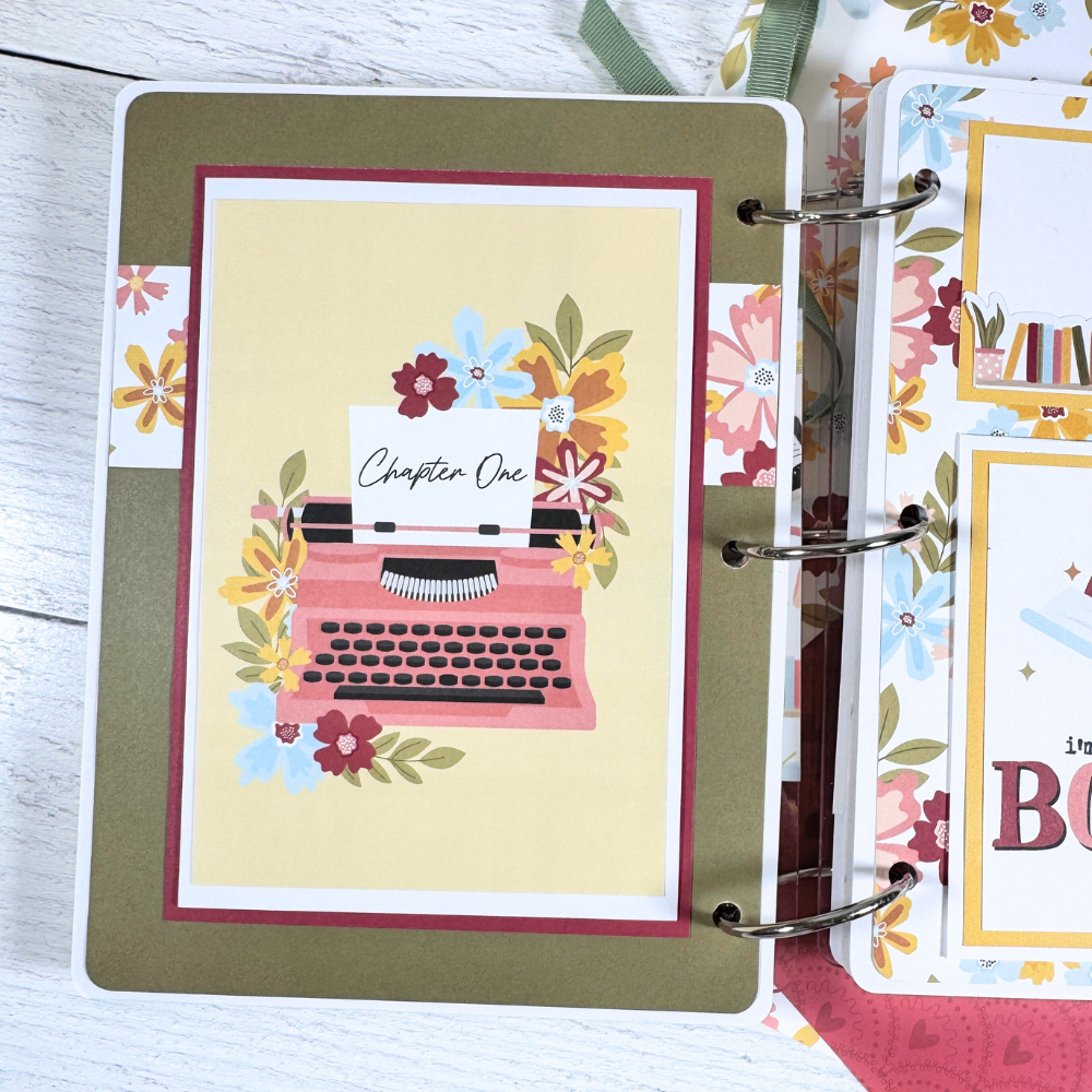 Book Reading Journal Scrapbook Album Page with a fold-out card, flowers, and a typewriter