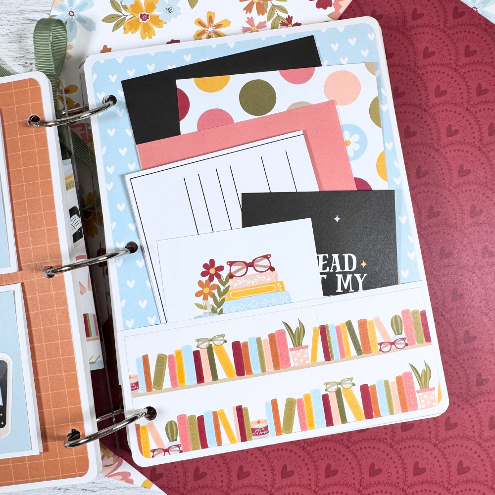 Book Reading Journal Scrapbook Album Page with a pocket, colorful books, and lots of cute journaling cards