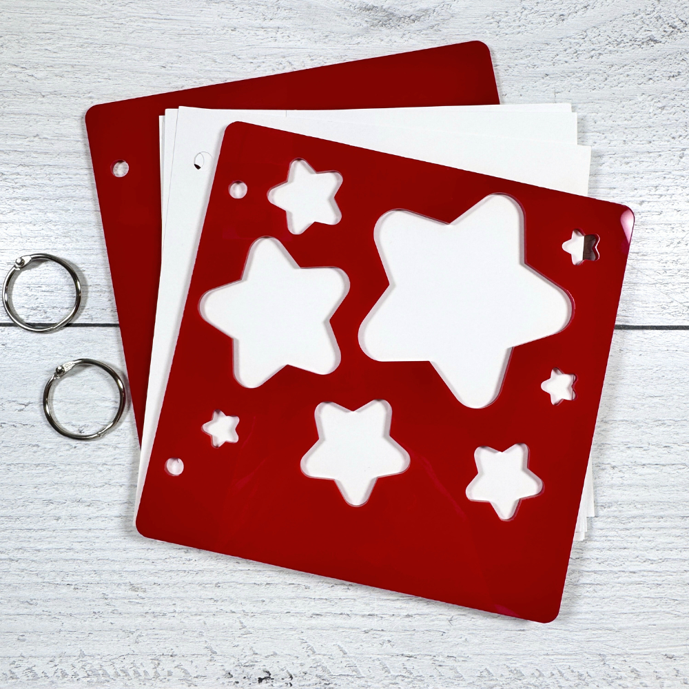 Acrylic Peek-A-Boo Stars Mini Album with star shaped cut-outs, white card stock pages, and binding rings